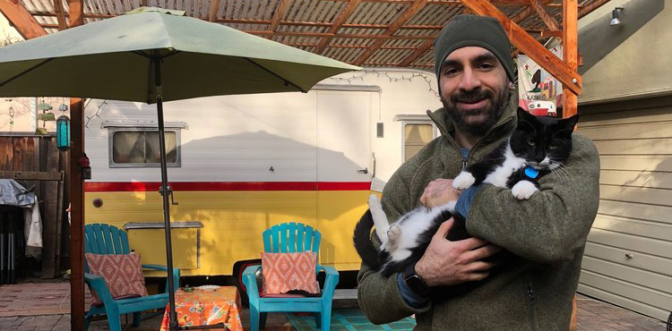 A photo of a monkey looking at a mirror